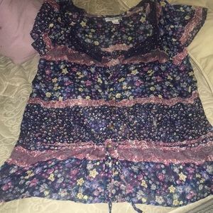 Blue lace blouse with floral design